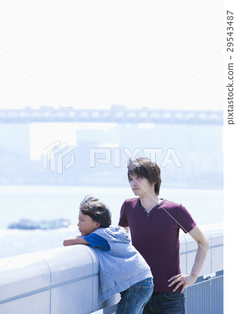 Father and son watching the sea Father and son watching the sea 29543487