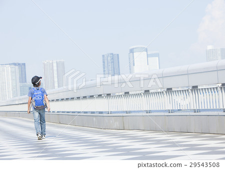 A boy behind the walking figure A boy behind the walking figure 29543508