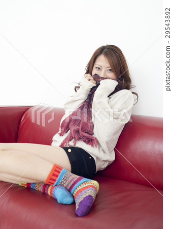 A young lady sitting on the sofa A young lady sitting on the sofa 29543892