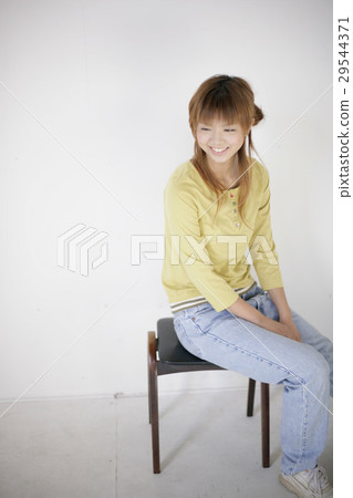 Woman sitting on chair Woman sitting on chair 29544371