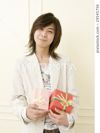 A man holding a gift A man holding a gift 29545756