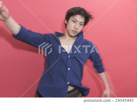 A young man dancing 29545945