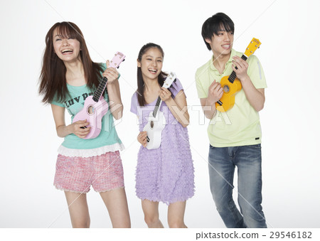 Young men and women playing ukulele 29546182