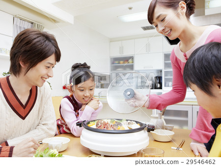 Parent and child surrounding the hot pot 29546462