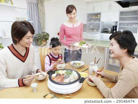 Three generations family surrounding a pod 29546474