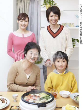 Three generations family surrounding a pod 29546475
