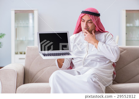 Arab businessman working sitting at couch Arab businessman working sitting at couch 29552812