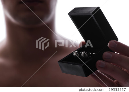 Man with box of cuff links Man with box of cuff links 29553357