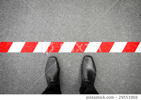 Black shoes standing at the red-white line Black shoes standing at the red-white line 29553908