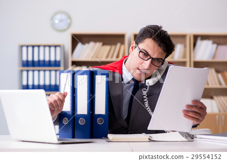 Superhero businessman working in the office 29554152