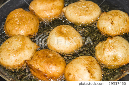 Donuts frying in deep fat. Preparation of Donuts frying in deep fat. Preparation of 29557460