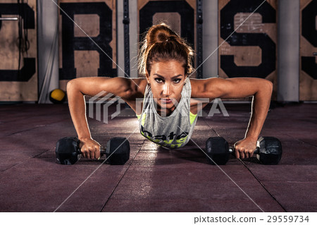 Female exercising at gym. Female exercising at gym. 29559734