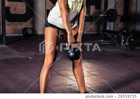 Woman in sportswear doing workout 29559735
