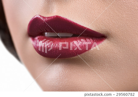 Close up shot of the lips of a woman wearing Close up shot of the lips of a woman wearing 29560782