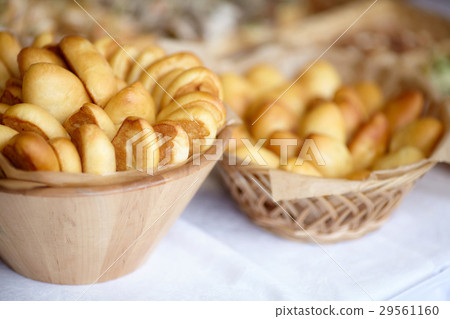 Bowl of oven fresh baked patties, russian pirozhki 29561160
