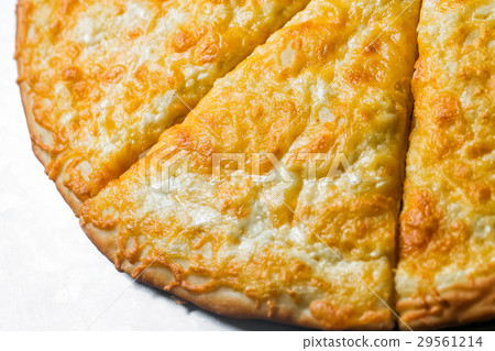 Pizza quattro fromaggi, by cut to pieces on a 29561214