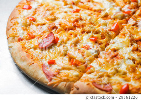 pizza with sausage, by cut to pieces on a metal 29561226