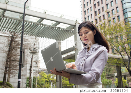 Business photography, strong woman, using computer, serious Business photography, strong woman, using computer, serious 29561504