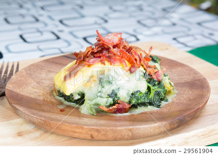 Baked spinach and cheese on plate Baked spinach and cheese on plate 29561904