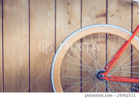 bicycle parked with wood wall, close up image 29562511