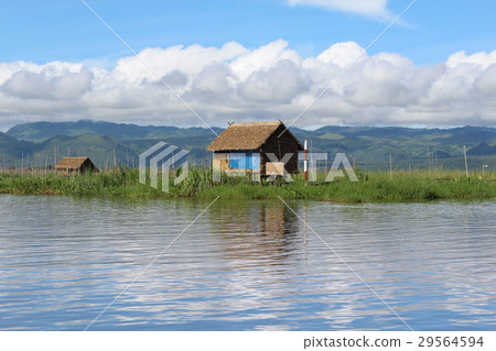 House on the lake reflecting the traditional water surface Myanmar Inle Lake 29564594