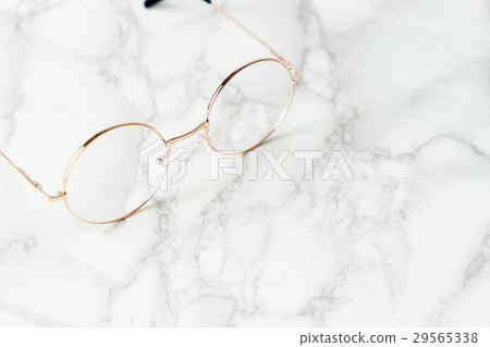 Golden Eyeglasses on luxury marble surface Golden Eyeglasses on luxury marble surface 29565338