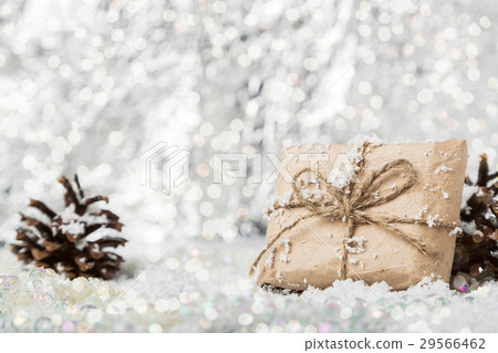 Christmas vintage gift on snowy blurry background Christmas vintage gift on snowy blurry background 29566462