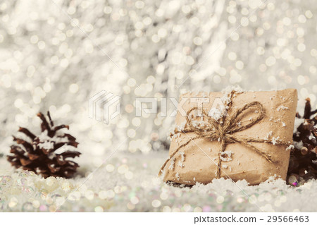 Christmas vintage gift on snowy blurry background Christmas vintage gift on snowy blurry background 29566463