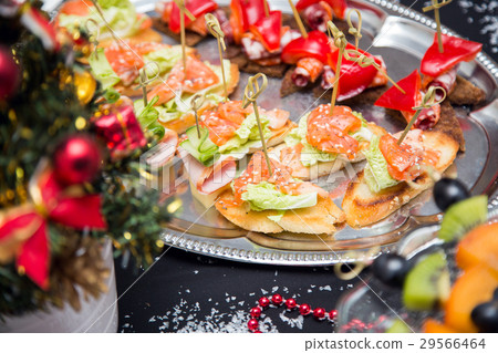 Buffet table with canape and red fish 29566464