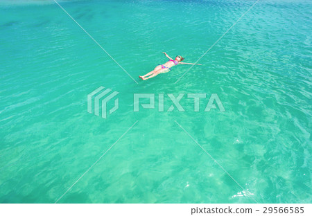 Woman floating on a back in the beautiful sea 29566585