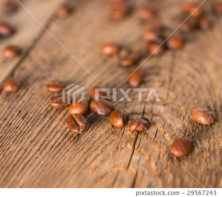 Coffee beans on the wooden table in sunset rays 29567243
