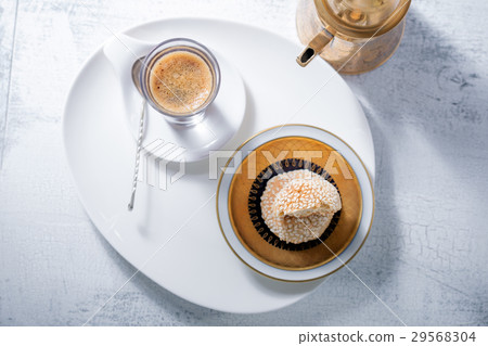 Coffee and handmade almond cookies on the table. Coffee and handmade almond cookies on the table. 29568304