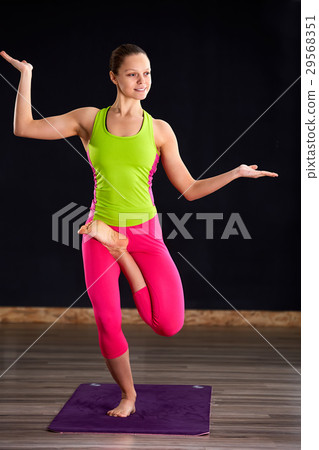 Beautiful young woman working out indoors, doing Beautiful young woman working out indoors, doing 29568351