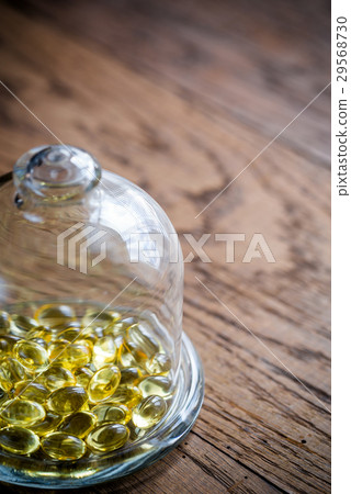 Omega-3 capsules under the glass dome 29568730