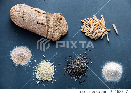 Wholegrain products on the dark wooden background Wholegrain products on the dark wooden background 29568737