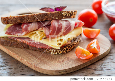 Sandwich with  ham and cheese 29568775