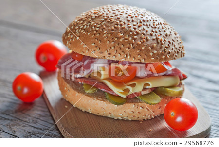 Sandwich with  ham, cheese and cherry tomatoes 29568776