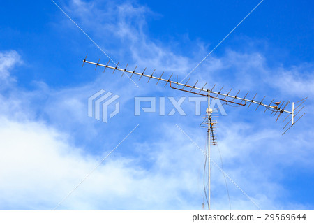 Old antenna with blue sky background 29569644