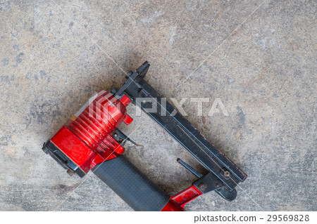pneumatic staples on cement background pneumatic staples on cement background 29569828