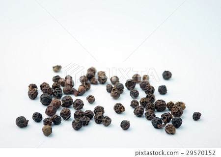Black peppers on wooden spoon. Black peppers on wooden spoon. 29570152