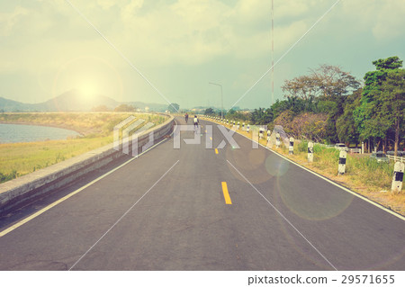 Cyclist riding bicycle in the morning Cyclist riding bicycle in the morning 29571655
