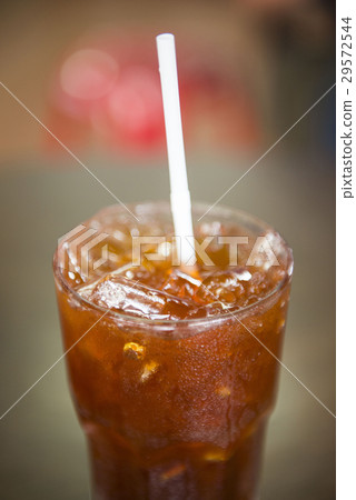 Thai black tea with ice in glass Thai black tea with ice in glass 29572544