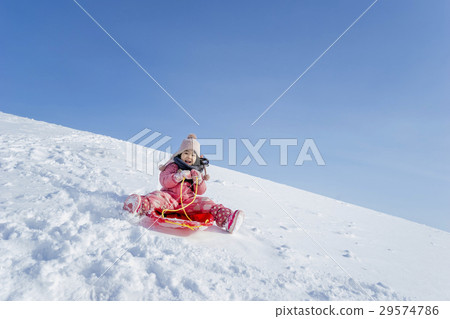 A girl playing snow A girl playing snow 29574786