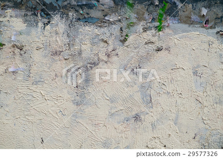 Old painted background wall with pieces of paper 29577326