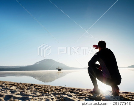 Man running on lake beach at sunrise.Healthy style Man running on lake beach at sunrise.Healthy style 29577548