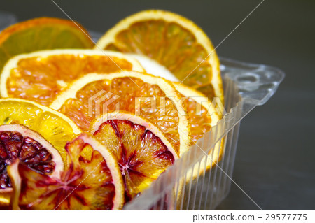 Dried orange and lemon slices background Dried orange and lemon slices background 29577775