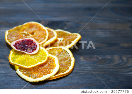 Dried orange and lemon slices background 29577776
