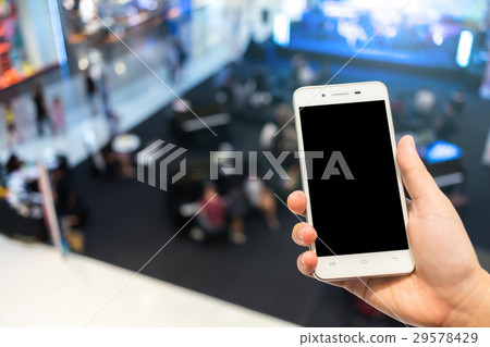 female use cell phones blurred images in the mall female use cell phones blurred images in the mall 29578429
