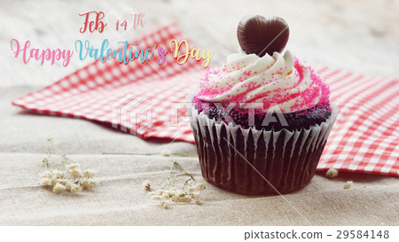 cupcake on old wooden background 29584148