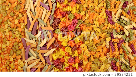 Assortment of colored uncooked Italian pasta  29584231